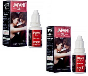 Two boxes and two bottles of 'Japani Oil' for men on a white background