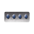 Four blue pills in a transparent plastic blister pack on a white background
