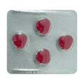 Red pills in a transparent blister pack on a white background
