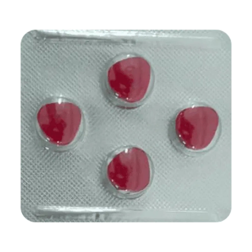 Red pills in a transparent blister pack on a white background
